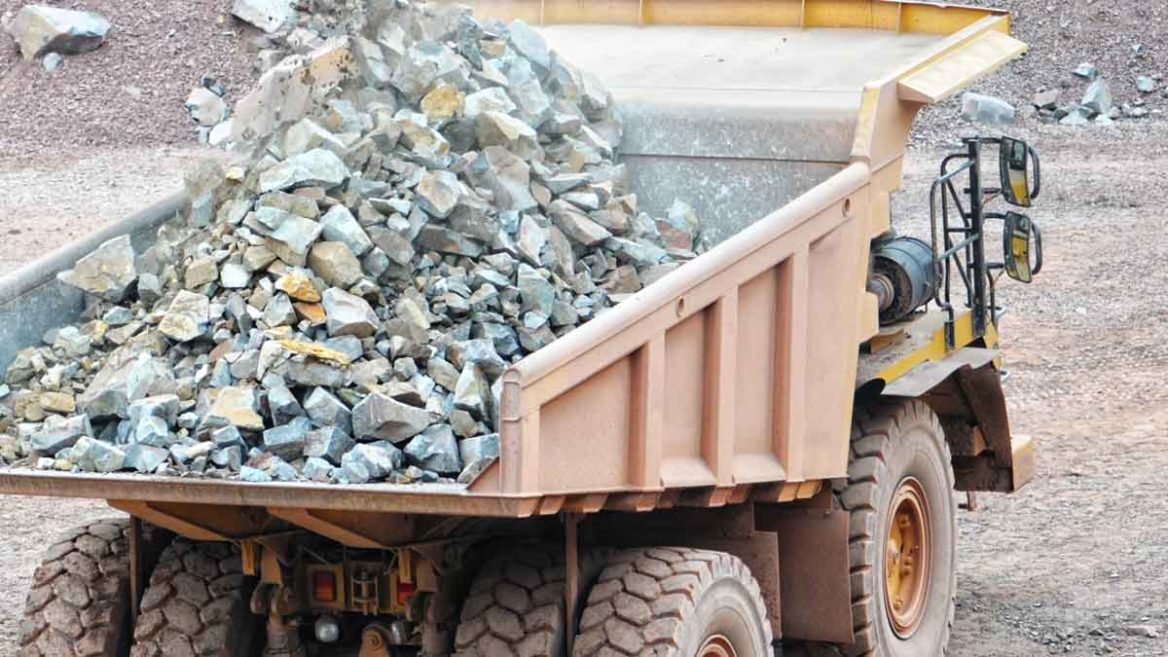 Rock from Dump Truck Crashes through Car Windshield, Killing Driver